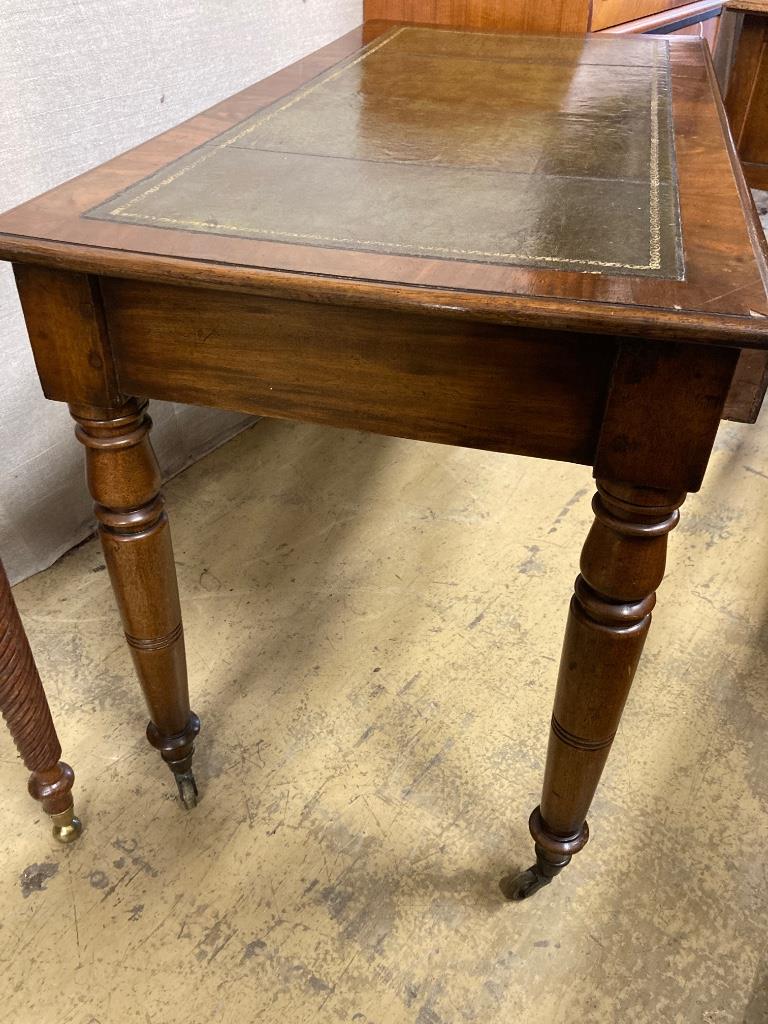 A Victorian mahogany two drawer writing table, length 114cm, depth 58cm, height 73cm